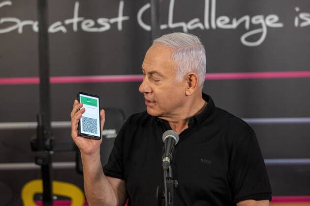 Israeli Prime Minister Benjamin Netanyahu visits a fitness gym ahead of the re-opening of the branch in Petah Tikva, Israel on Saturday, February 20, 2021, Israel continues lifting the lockdown with the opening of gyms, hotels, and shopping centers starting February. 21. Pool photo by Tal Shahar  JERX20210220202 TalxShahar