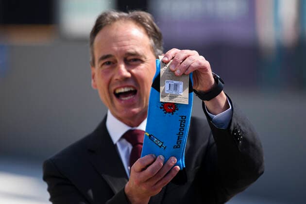 ACT COVID19 VACCINE ROLLOUT, Australian Health Minister Greg Hunt holds up a pair of socks depicting a syringe and a virus after the start of the Biotech Pfizer COVID-19 vaccine rollout at the COVID-19 surge centre in Canberra, Monday, February 22, 2021. Australia will begin its roll out of the Pfizer coronavirus vaccine on Monday, the country s most complicated logistical exercise to date. ( NO ARCHIVING, EDITORIAL USE ONLY, NO USE IN BOOKS WITHOUT CONSENT CANBERRA ACT AUSTRALIA  Copyright: xLUKASxCOCHx 20210222001522295717