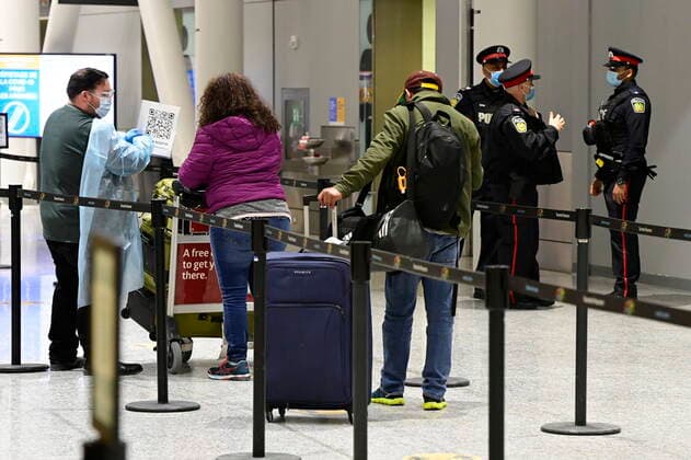 February 22, 2021, Toronto, on, Canada: Travellers, who are not affected by new quarantine rules, arrive at Terminal 3 at Pearson Airport in Toronto early Monday, February 22, 2021. Prime Minister Justin Trudeau announced that all travellers entering Canada by air would have to quarantine in a hotel for three days at their own expense starting later today. Toronto Canada  - ZUMAc35_ 20210222_zaf_c35_002 Copyright: xFrankxGunnx