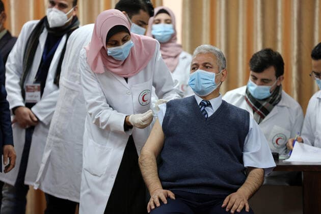 February 22, 2021, Gaza city, Gaza Strip, Palestinian Territory: Palestinian doctors receive the first dose of a COVID-19 vaccine at the Ministry of Health, in Gaza city, on February 22, 2021. Around 20,000 coronavirus vaccine doses from the UAE arrived in Gaza Sunday Gaza city Palestinian Territory - ZUMAap3_ 20210222_zaf_ap3_001 Copyright: xAshrafxAmrax