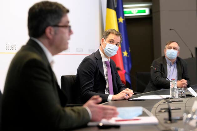 Sciensano s Steven Van Gucht , Prime Minister Alexander De Croo and Sciensano s Yves Van Laethem pictured during a press conference of the Federal Government regarding the Covid-19 infection statistics, Monday 22 February 2021 in Brussels.  POOLxPHILIPxREYNAERS 2649758