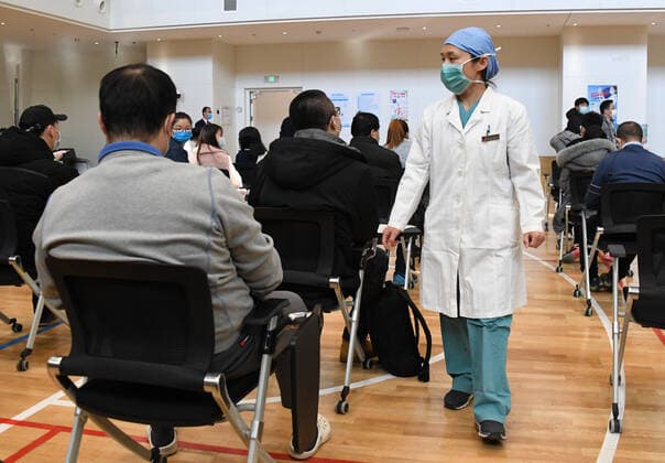 (210222) -- BEIJING, Feb. 22, 2021 -- A medical worker works at a temporary COVID-19 vaccination site at a company in the ZPark Phase 2 in Haidian District of Beijing, capital of China, Feb. 22, 2021. It is expected to take two days to complete the vaccination of more than 3,800 employees of the enterprise. ) CHINA-BEIJING-HAIDIAN-VACCINATION (CN) RenxChao 