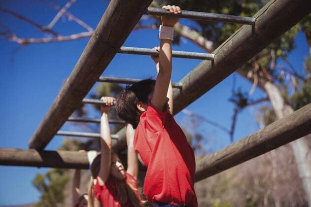 Kids climbing monkey bars during obstacle course training Kids climbing monkey bars during obstacle course training in the boot camp, model released, , property released, Cape Town, South Africa, 16.03.2017, 1000378.jpg, boot, camp, boot camp, park, sky, sunny, summer, sportswear, athlete, athletic, sport, sports, obstacle course, obstacle, monkey bars, holding, climbing, hanging, training, practice, practicing, healthy lifestyle, together, childhood, fit, fitness, wellness, wellbeing, active, activity, health, healthy, physical, determined, determination, effort, endurance, recreation, leisure, lifestyle Outdoors,Day