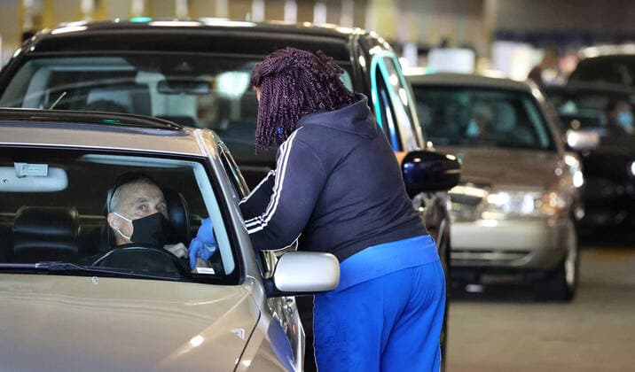 February 22, 2021, Orlando, FL, USA: A Florida resident gets vaccinated at the drive-thru site at the Orange County Convention Center in Orlando, Monday, February 22, 2021. The Florida Department of Health continues to administer COVID-19 vaccinations at the convention center s North Concourse. Additional FEMA vaccination sites will open starting next week in Orlando and two other Florida cities. Orlando USA - ZUMAm67_ 20210222_zaf_m67_015 Copyright: xJoexBurbankx