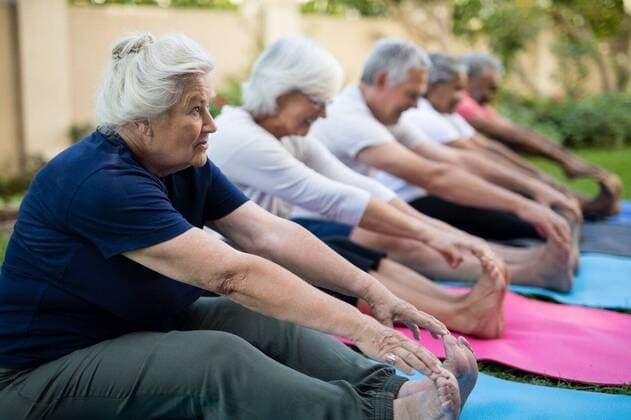 IMAGO Creative: NGO, Rehabilitation und Gesundheitswesen Senior female exercising with friends Senior female exercising with friends on mats at park, model released, , property released, Cape Town, South Africa, 2017-04-27T23:00:00.000Z, 1041919.jpg, exercising, relaxation exercise, yoga, public park, sports clothing, active seniors, freshness, friendship, lifestyle, retirement, retirement community, nursing home, geriatrics, sport, sports training, togetherness, training class, wellbeing, body care, multi-ethnic, active, exercise, fit, fitness, health, healthy, physical, sportswear, sporty, training, workout, exercise mat, golden years, sitting, smiling, happy, cheerful, flexibility, stretching, in a row, assisted living, healthcare and medicine 60s, Senior, Elderly, Man, Male, Mixed-Race, Cauc
