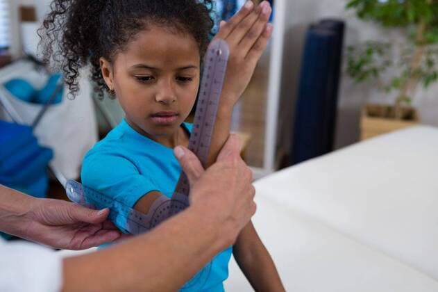 Physiotherapist examining girl patients wrist with goniometer Physiotherapist examining girl patients wrist with goniometer in the clinic, model released, , property released, Cape Town, South Africa, 2017-04-22T23:00:00.000Z, 1052667.jpg, physio, physiotherapy, physiotherapist, practitioner, orthopedic, osteopath, physical therapy, physical therapist, therapy, doctor, clinic, hospital, specialist, health service, healthcare, bodycare, healthcare and medicine, expertise, profession, professional, recovery, care, treatment, injury, patient, holding, examining, checking, wrist, joint, assistance, assisting, measurement, measuring, goniometer, medical ruler, instrument of measurement, equipment, accuracy, childhood, innocence, cute 50s, Matur