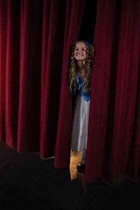 Female artist peeking through the red curtain Smiling female artist peeking through the red curtain, model released, , property released, Cape Town, South Africa, 20.04.2017, 1061380.jpg, theatre, stage, theatrical, curly, artist, actress, professional, profession, performance, performer, smiling, cheerful, happy, joy, looking, excited, peeking, red, curtain, entertainment, expertise, show, event, positivity, beautiful, pretty, attractive, hobbies, leisure, lifestyle Child, Girl, Female, Caucasian, 10-11 Years, Girls, Caucasian Ethnicity Indoors,Full length
