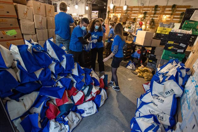 (210222) -- PARIS, Feb. 22, 2021 -- Volunteers prepare free food for people in precarious situations during the COVID-19 pandemic in Paris, France, on Feb. 22, 2021. (Photo by Xinhua) FRANCE-PARIS-COVID-19-FREE FOOD-DISTRIBUTION AurelienxMorissard 