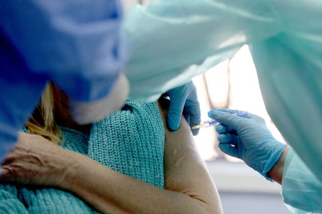 Vaccination in Zagreb, Croatia A woman receive coronavirus disease (COVID-19) vaccine during a mass vaccination in Zagreb, Croatia on February 23, 2021 PatrikxMacek PIXSELL