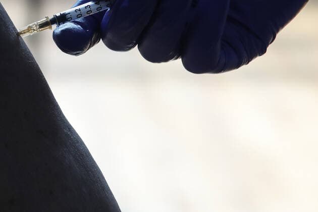 Vaccination in Zagreb, Croatia A man receive coronavirus disease (COVID-19) vaccine during a mass vaccination in Zagreb, Croatia on February 23, 2021 SanjinxStrukic PIXSELL