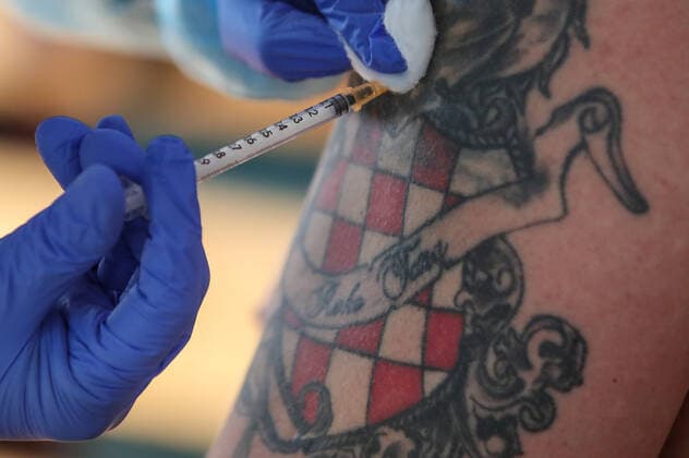 Vaccination in Zagreb, Croatia A man receive coronavirus disease (COVID-19) vaccine during a mass vaccination in Zagreb, Croatia on February 23, 2021 SanjinxStrukic PIXSELL