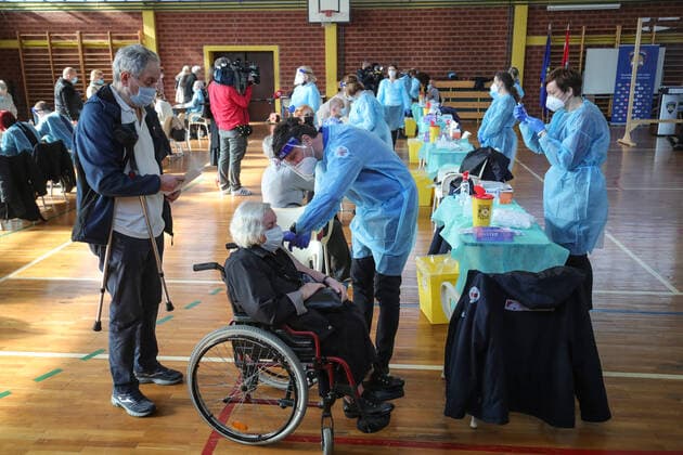Vaccination in Zagreb, Croatia A woman receive coronavirus disease (COVID-19) vaccine during a mass vaccination in Zagreb, Croatia on February 23, 2021. SanjinxStrukic PIXSELL