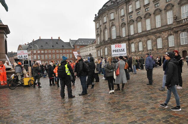 Copenhagen, Denmark. 23 February 2021, Danes proetesting againest coronavirus pandemic new debate in danish parliamenet about quick corona virus pandemic law in danish parliament with all political parties and stage anti pandemic law debates in front of danish parliament and danish police stand peaceful proteact danish parliament in front christiansborg danish parliament in Copenhagen. (Photo..Francis Dean Deanpictures)