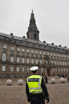 Copenhagen, Denmark. 23 February 2021, Danes proetesting againest coronavirus pandemic new debate in danish parliamenet about quick corona virus pandemic law in danish parliament with all political parties and stage anti pandemic law debates in front of danish parliament and danish police stand peaceful proteact danish parliament in front christiansborg danish parliament in Copenhagen. (Photo..Francis Dean Deanpictures)
