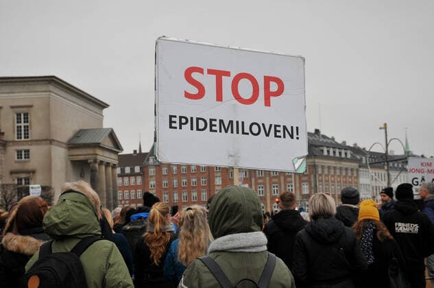 Copenhagen, Denmark. 23 February 2021, Danes proetesting againest coronavirus pandemic new debate in danish parliamenet about quick corona virus pandemic law in danish parliament with all political parties and stage anti pandemic law debates in front of danish parliament and danish police stand peaceful proteact danish parliament in front christiansborg danish parliament in Copenhagen. (Photo..Francis Dean Deanpictures)