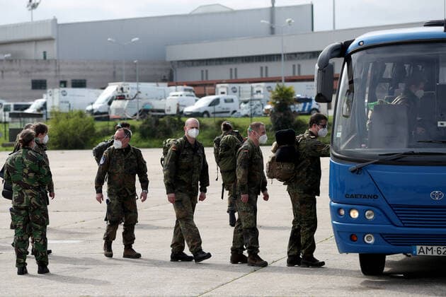 February 23, 2021, Lisbon, Portugal: German army medical experts get into a in a bus at Figo Maduro military airbase in Lisbon, Portugal on February 23, 2021. Based on a bilateral agreement, a second team of German army medical experts arrived in Portugal on Tuesday to replace the team that has been in Portugal since February 3 to assist the country in its fight against the COVID-19 pandemic. Lisbon Portugal - ZUMAf123 20210223_zap_f123_009 Copyright: xPedroxFiuzax