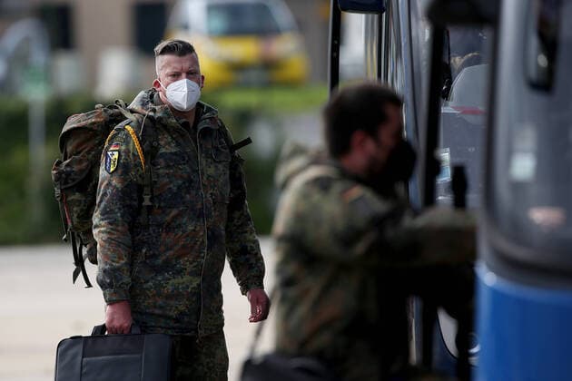 February 23, 2021, Lisbon, Portugal: German army medical experts get into a in a bus at Figo Maduro military airbase in Lisbon, Portugal on February 23, 2021. Based on a bilateral agreement, a second team of German army medical experts arrived in Portugal on Tuesday to replace the team that has been in Portugal since February 3 to assist the country in its fight against the COVID-19 pandemic. Lisbon Portugal - ZUMAf123 20210223_zap_f123_011 Copyright: xPedroxFiuzax