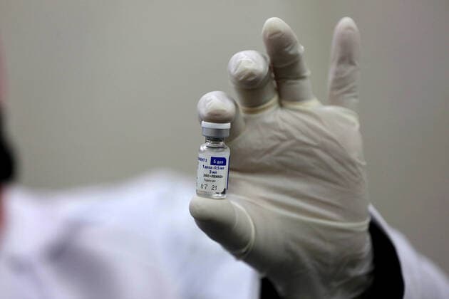 February 23, 2021, Khan Yunis, Gaza Strip, Palestinian Territory: A Palestinian health worker prepares a shot of the Russian Sputnik V coronavirus vaccine at European Hospital, in Khan Yunis, in the southern Gaza Strip on February 23, 2021. Around 20,000 coronavirus vaccine doses from the UAE arrived in Gaza, a delivery reportedly orchestrated by a rival of Palestinian president Mahmud Abbas three months before scheduled Palestinian elections Khan Yunis Palestinian Territory - ZUMAap3_ 20210223_zaf_ap3_045 Copyright: xAshrafxAmrax