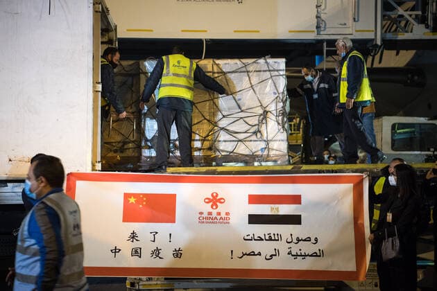 (210223) -- CAIRO, Feb. 23, 2021 -- Workers upload a batch of China s Sinopharm COVID-19 vaccines onto a truck in Cairo International Airport, Egypt, Feb. 23, 2021. The shipment of COVID-19 vaccines from Chinese company Sinopharm arrived in Egyptian capital Cairo on Tuesday. ) EGYPT-CAIRO-CHINA-VACCINE-ARRIVAL WuxHuiwo 