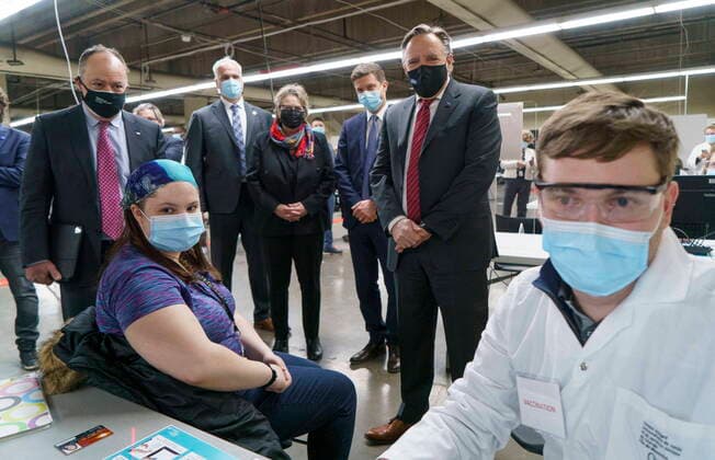 February 23, 2021, Montreal, PQ, Canada: Quebec Premier Francois Legault and Health Minister Christian Dube watch a woman register for her COVID-19 vaccine at a clinic in Montreal s Olympic Stadium on Tuesday, February 23, 2021. Montreal Canada  - ZUMAc35_ 20210223_zaf_c35_048 Copyright: xPaulxChiassonx