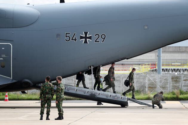 (210224) -- LISBON, Feb. 24, 2021 -- German army medical experts disembark at Figo Maduro military airbase in Lisbon, Portugal on Feb. 23, 2021. Portugal on Tuesday welcomed the second team of German military health professionals who assist the country in the treatment of COVID-19 patients. (Photo by Xinhua) PORTUGAL-LISBON-GERMANY-MEDICAL EXPERTS-COVID-19 PedroxFiuza 