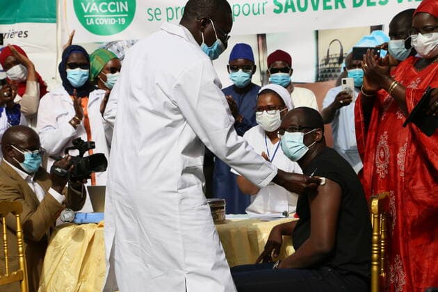 (210224) -- DAKAR, Feb. 24, 2021 -- Senegalese Minister of Health and Social Action Abdoulaye Diouf Sarr receives a dose of COVID-19 vaccine provided by Chinese firm Sinopharm in Dakar, Senegal on Feb. 23, 2021. Senegal on Tuesday officially began the first phase of COVID-19 vaccination, taking a new step in the crusade against the pandemic. Abdoulaye Diouf Sarr received the first dose of COVID-19 vaccine in front of the press at his ministry, which symbolized the starting point of Senegal s vaccination campaign. ) SENEGAL-CHINA-COVID-19-VACCINE-INOCULATION XingxJianqiao 