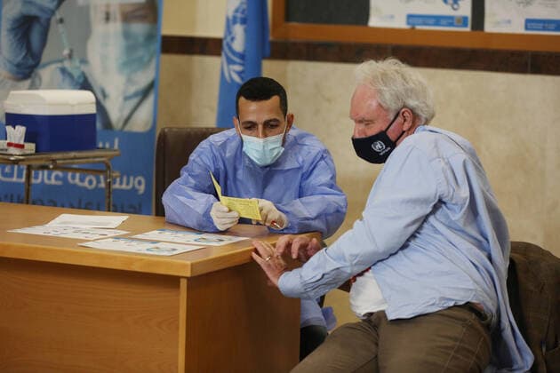 February 24, 2021, Gaza city, Gaza Strip, Palestinian Territory: Director of UNRWA Affairs in Gaza strip, Matthias Schmale, receives a dose of coronavirus disease (COVID-19) vaccine at a UN clinic in Gaza City, on February 24, 2021. Palestinians in Gaza began a limited COVID-19 vaccination programme on Monday after receiving doses donated by Russia and the United Arab Emirates, but a wider campaign could be further off as health officials await larger shipments Gaza city Palestinian Territory - ZUMAap3_ 20210224_zaf_ap3_004 Copyright: xAshrafxAmrax