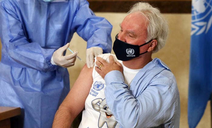 February 24, 2021, Gaza city, Gaza Strip, Palestinian Territory: Director of UNRWA Affairs in Gaza strip, Matthias Schmale, receives a dose of coronavirus disease (COVID-19) vaccine at a UN clinic in Gaza City, on February 24, 2021. Palestinians in Gaza began a limited COVID-19 vaccination programme on Monday after receiving doses donated by Russia and the United Arab Emirates, but a wider campaign could be further off as health officials await larger shipments Gaza city Palestinian Territory - ZUMAap3_ 20210224_zaf_ap3_006 Copyright: xAshrafxAmrax