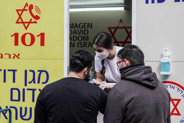 February 24, 2021, Jerusalem, Israel: The IDF Home Front Command in coordination with Magen David Adom, serving as the Israeli Red Cross organization and leading EMS, make COVID-19 vaccinating more accessible to those still in denial or refusal operating a mobile vaccination station out of a caravan at JerusalemÃ¢â‚¬â ¢s Shuk Mahane Yehuda Market. Jerusalem Israel - ZUMAa126 20210224_zap_a126_010 Copyright: xNirxAlonx