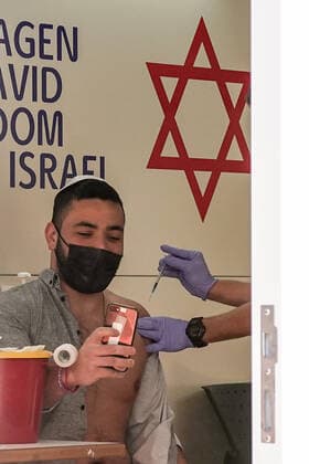 February 24, 2021, Jerusalem, Israel: The IDF Home Front Command in coordination with Magen David Adom, serving as the Israeli Red Cross organization and leading EMS, make COVID-19 vaccinating more accessible to those still in denial or refusal operating a mobile vaccination station out of a caravan at JerusalemÃ¢â‚¬â ¢s Shuk Mahane Yehuda Market. Jerusalem Israel - ZUMAa126 20210224_zap_a126_020 Copyright: xNirxAlonx