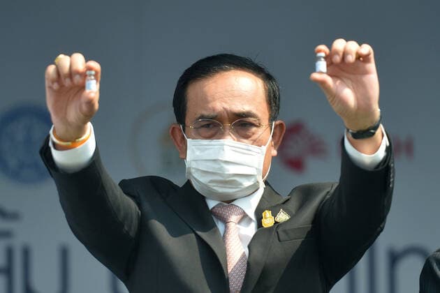 (210224) -- BANGKOK, Feb. 24, 2021 -- Thai Prime Minister Prayut Chan-o-cha presents two vials of Sinovac COVID-19 vaccine at Suvarnabhumi Airport in Bangkok, Thailand, Feb. 24, 2021. The first batch of COVID-19 vaccines that Thailand ordered from China s Sinovac Biotech arrived in the capital Bangkok Wednesday, putting the country on track to kickstart its national inoculation program. ) THAILAND-BANGKOK-CHINA-COVID-19-VACCINE-ARRIVAL RachenxSageamsak 