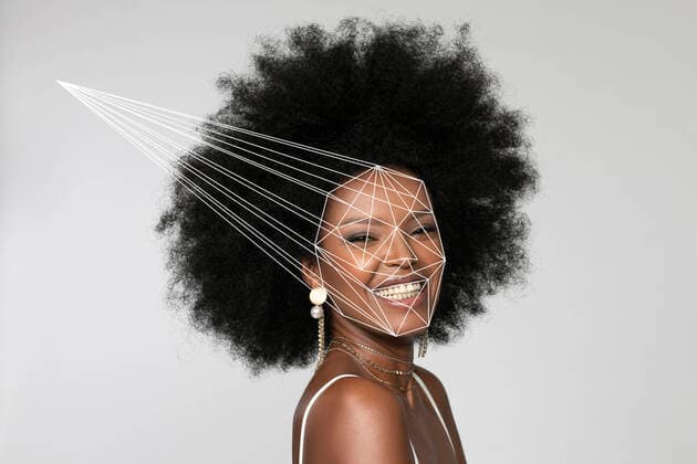 Smiling Afro woman with facial recognition laser beam against white background model released Symbolfoto EIF00370