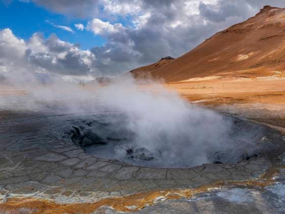 Steam emitting from geyser against mountain, Hverir, Iceland LAF02675