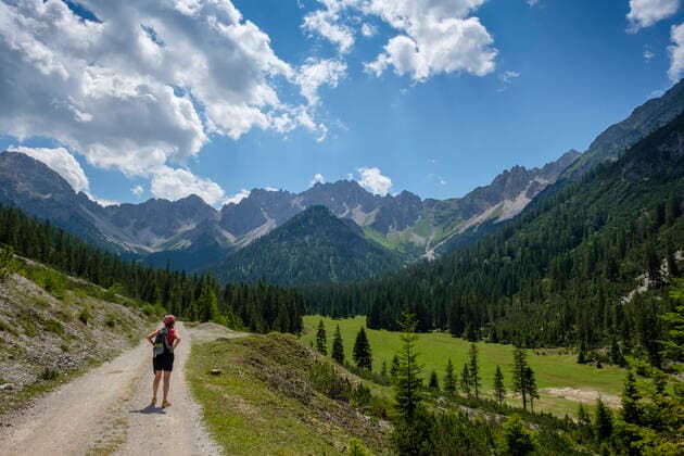 Hiker looking Karwendel mountains view while standing on footpath at Tyrol, Austria model released Symbolfoto LBF03334