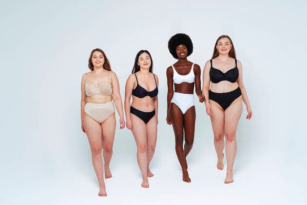 IMAGO Creative: 2021 Trends IMAGO Creative: Clickbait, Modetrends Confident young women smiling while walking in studio model released Symbolfoto property released OIPF00173