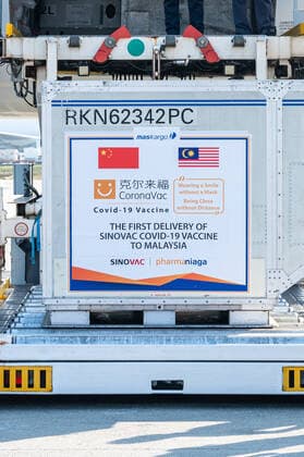 (210227) -- KUALA LUMPUR, Feb. 27, 2021 -- The first batch of COVID-19 vaccines made by the Chinese biopharmaceutical company Sinovac Biotech is unloaded upon its arrival at the Kuala Lumpur International Airport in Sepang, Malaysia, Feb. 27, 2021. The first batch of COVID-19 vaccines made by the Chinese biopharmaceutical company Sinovac Biotech arrived in Malaysia on Saturday, boosting the country s capability in the fight against the pandemic. ) MALAYSIA-COVID-19-CHINA-VACCINES-ARRIVAL ZhuxWei 