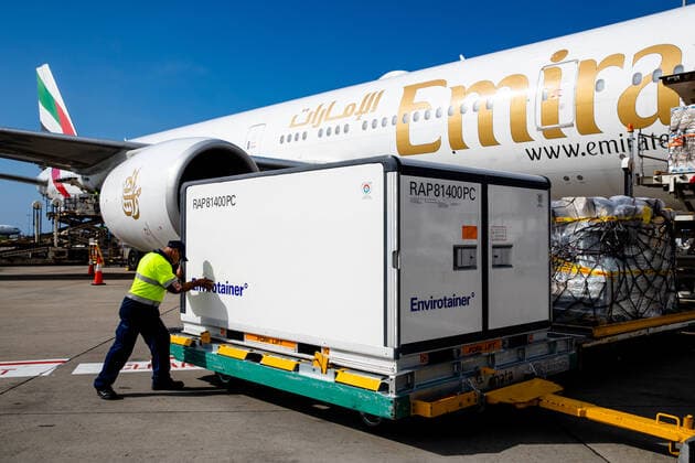 The first Australian shipment of AstraZeneca COVID-19 vaccines is seen after landing at Sydney International Airport, Sunday, February 28, 2021. 300,000 doses of the University of Oxford AstraZeneca COVID-19 vaccine have arrived in Sydney today. (AAP Image Edwina Pickles) NO ARCHIVING Sydney Australia