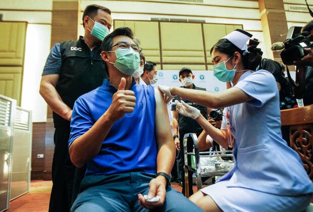 February 28, 2021, Bangkok, Thailand: A health worker gestures as he gets a shot of the vaccine during the vaccination..Thailand carries out its first Covid-19 vaccine campaign using the China™s Sinovac vaccine administered to frontline health workers at the Bamrasnaradura Infectious Diseases Institute in Bangkok. Bangkok Thailand - ZUMAs197 20210228_zaa_s197_029 Copyright: xChaiwatxSubprasomx