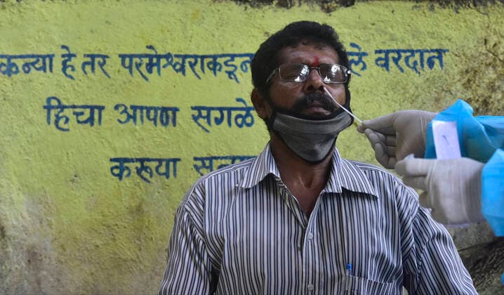 MUMBAI, INDIA - FEBRUARY 27: BMC medical staff conducts swab test of resident staying in Sewri, on February 28, 2021 in Mumbai, India. (Photo by Anshuman Poyrekar Hindustan Times) Medical Team Conducts COVID-19 Coronavirus Test