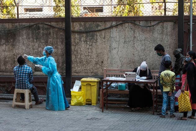 MUMBAI, INDIA - FEBRUARY 27: Healthcare worker during swab test of the people at Govandi, on February 27, 2021 in Mumbai, India. (Photo by Pratik Chorge Hindustan Times) Medical Team Conducts COVID-19 Coronavirus Test