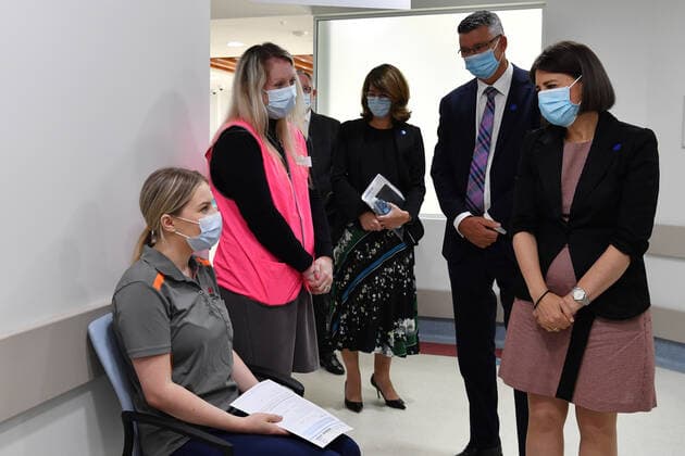 GLADYS BEREJIKLIAN COVID19 VACCINATION HUB TOUR, Premier Gladys Berejiklian chats with NSW Health Orderly Maddie Sara during a tour of the Westmead Hospital Vaccination Hub in Sydney, Monday, March 1, 2021. Phase 1a of the nation-wide vaccination program began last week, with healthcare and border workers the first to be vaccinated. ( NO ARCHIVING, EDITORIAL USE ONLY, NO USE IN BOOKS WITHOUT CONSENT SYDNEY NSW AUSTRALIA  Copyright: xDEANxLEWINSx 20210301001523890812