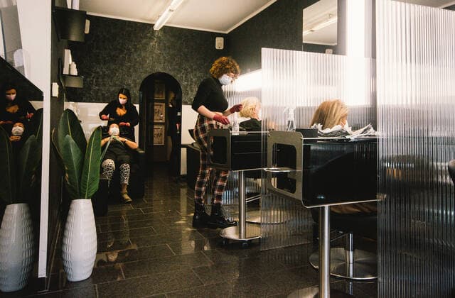 (210301) -- COLOGNE, March 1, 2021 -- Employees serve customers at a hair salon amid COVID-19 pandemic in Cologne, Germany, March 1, 2021. Hair salons in Germany reopened on Monday with COVID-19 prevention measures. (Photo by Xinhua) GERMANY-COLOGNE-COVID-19-HAIR SALON-REOPENING TangxYing 