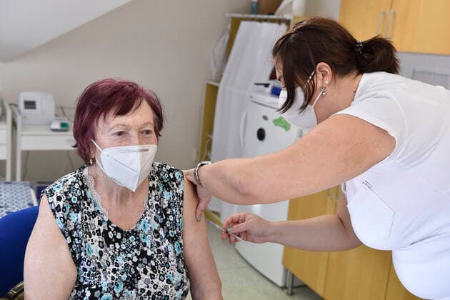 An elderly woman receives a vaccine against the covid-19 at the surgery office in Moravska Nova Ves in Breclav region, Czech Republic, March 1, 2021. (CTKxPhoto VaclavxSalek) CTKPhotoP202103010739801  sal 02