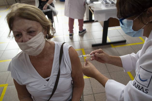 Vaccination of elderly people over 80 years old in Sao Paulo. Vaccination of elderly people over 80 years old in Sao Paulo. March 1, 2021, Sao Paulo, Brazil: Vaccination against Covid-19 of elderly people aged over 80 at UBS HUMAITA (Basic Health Unit) in Bela Vista, Sao Paulo, which uses the EMEF CELSO LEITE RIBEIRO FILHO school next to the unit as a vaccination site in Sao Paulo. Vaccination of elderly people over 80 years old in Sao Paulo.  Copyright: xLecoxVianax