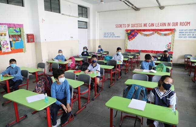 LUCKNOW, INDIA - MARCH 1: Students at City Montessori school being taught the importance of social distancing as classes for primary schools resume on March 1, 2021 in Lucknow, India. Nearly a year after the Centre imposed a nationwide lockdown due to the COVID-19 outbreak, several states and UTs have decided to reopen schools and colleges from March 1. As the deadly virus cases are now steadily dropping, the offline classes are going to resume in states such as Bihar, Meghalaya, Jammu and Kashmir, Haryana, among others.(Photo by Deepak Gupta Hindustan Times) Primary Schools Reopen For The First Time Since Lockdown Due To Covid-19