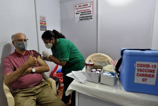 MUMBAI, INDIA - MARCH 1: A senior citizen getting their first dose of a Covid-19 vaccination, at BKC on March 1, 2021 in Mumbai, India. India?s Covid-19 vaccination drive was extended today to include the elderly and those with co-morbidities. (Photo by Satish Bate Hindustan Times) Covid Vaccination Phase 2 Starts In India
