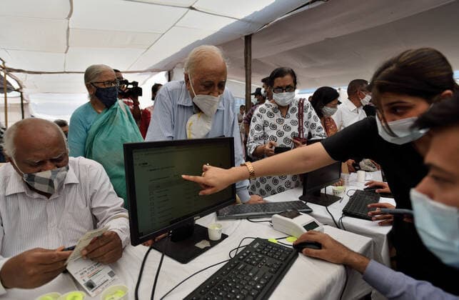 MUMBAI, INDIA - MARCH 1: Senior citizen registering to get their first dose of a Covid-19 vaccination, at BKC on March 1, 2021 in Mumbai, India. India?s Covid-19 vaccination drive was extended today to include the elderly and those with co-morbidities. (Photo by Satish Bate Hindustan Times) Covid Vaccination Phase 2 Starts In India