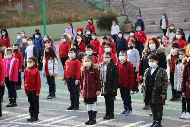 (210302) -- ANKARA, March 2, 2021 -- Students wearing face masks queue at the playground in a school in Ankara, Turkey on March 2, 2021. Turkey on Tuesday reported 11,837 new COVID-19 cases, including 668 symptomatic patients, as its daily infections exceeded 10,000 for the first time in about two months. (Photo by Xinhua) TURKEY-ANKARA-COVID-19-CASES MustafaxKaya 