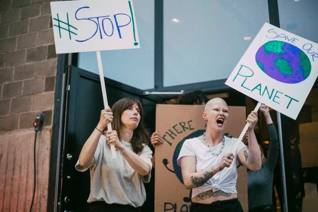 Female activist screaming while protesting for environmental issues Sweden, Stockholm, model released, property released Copyright: xMaskotx , MA84411