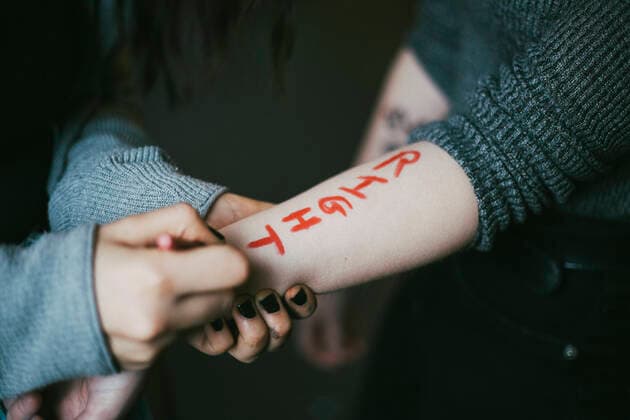IMAGO Creative: Tag der Menschenrechte am 10. Dezember Cropped image of female protestor writing on woman s hand Sweden, Stockholm, model released Copyright: xMaskotx , MA84431